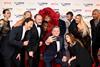 The 'Glass Onion: A Knives Out Mystery' cast with Netflix's Ted Sarandos