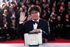 Bong Joon-ho poses with his Palme d'Or